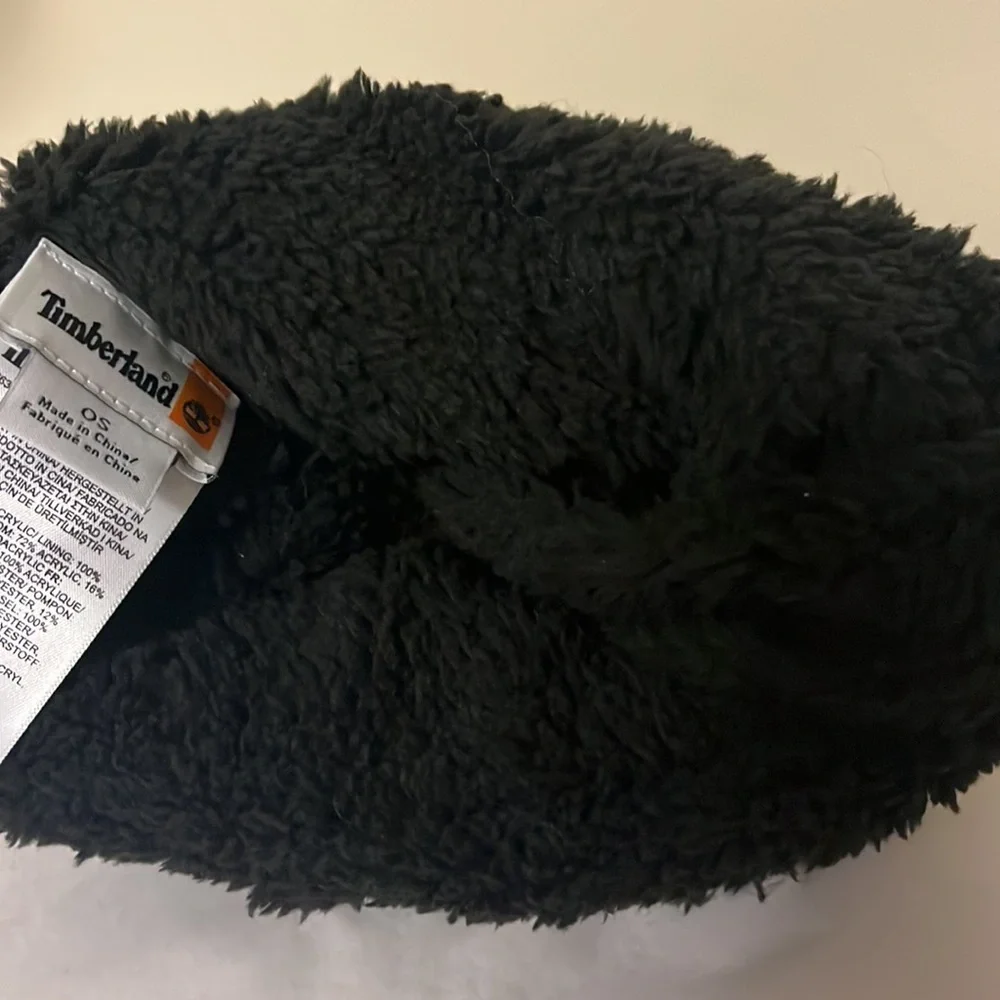 Timberland black cable knit, fleece lined hat with furry Pom on top, new